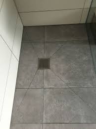 A linear drain works fine, even if the drain is in the center, as long as the drain runs pretty much the full width of the shower. Pin On Bathroom Refurbishment