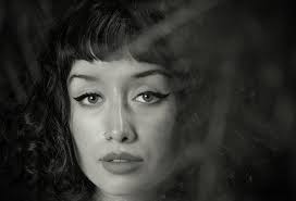 Womans face in grayscale photo