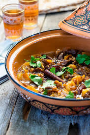 This Lamb Tagine With Dates Has Coriander Cinnamon And Saffron Mixed With The Onion Garlic And Tagine Recipes Lamb Tagine Recipe Moroccan Lamb Tagine Recipe