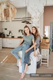 It was a casual t. Cheerful Casual Women Laughing And Sitting On Washing Machine In Spacious Kitchen Having Fun At Home Barefoot People Stock Photo 319029810