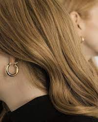 These earrings are a versatile and elegant statement, a timeless reimagining of a classic. Freja Hoop Earrings Medium Common Muse