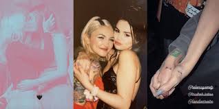 Julia michaels's perception and lightblub arm tattoo. Selena Gomez Julia Michaels Matching Tattoos Point To One Another