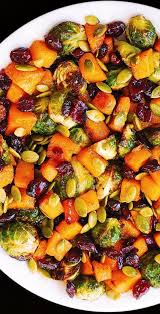 Roasted Brussels Sprouts Maple Butternut Squash Pumpkin Seeds And Cranberries In 2020 Roasted Brussel Sprouts Pumpkin Seed Recipes Sprout Recipes