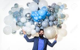 We don't want you overdoing it now, do we? Happy Birthday Concept Stylish Birthday Guy Holds Air Balloons Stock Photo Picture And Royalty Free Image Image 128701376