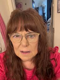 Senior deaf and blind woman donates knitted items