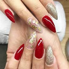 These adhesive stickers are applied to the nail bed and can be tailored to fit any nail shape to help you sculpt acrylic tips. 25 Flattering Red And Gold Nail Designs For 2021
