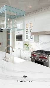 In this kitchen, medallion cabinetry in the providence reversed raised panel door with painted chai latte was installed on the perimeter and maple espresso stain on the island. An Elegant Marble Alternative Cambria Quartz Brittanicca Has The Durable And Low Maintenance Benefits White Kitchen Design Home Decor Kitchen Kitchen Remodel