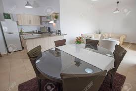 Find a wide selection of dining room furniture, mirrors, rugs and dinnerware at great value on athome.com. Kitchen And Dining Area In Luxury Apartment Show Home Showing Interior Design Decor Furnishing With Dining Table Stock Photo Picture And Royalty Free Image Image 122329360