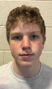 Trojan wrestlers pull away late to beat Little Lions