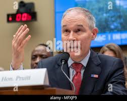 Representatives of the U.S. Environmental Protection Agency, Deborah Jordan  (left), Preston Cory (center) and Aaron Ringel listen to speakers comment 