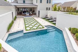 Grass Concrete Paver Spacers Lead To A Diamond Shaped In Ground Pool Modern Pools Mosaic Pool Pool Houses