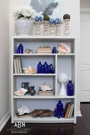 Look around your homes, you can use shutters, windows, chairs, crates. How To Decorate With Coffee Table Books In Your Home