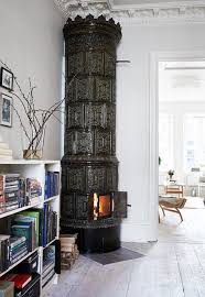 The scandinavian wood stove adds warmth to the modern space. Kakelugn Ode To The Swedish Stove Fireplace Design Home Fireplace Fireplace
