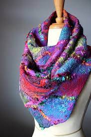 Nuno felting is the process of felting wool roving and/or wool yarns onto another fabric. Nuno Felted Scarf Vertigo Nuno Felt Scarf Felted Scarves Felt Fashion