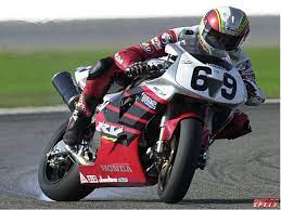 Nicky Hayden A Long Time Ago Slides His Honda Rc51 To The Checkered Flag Bike Racers Racing Bikes Nicky Hayden