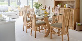 Dining set with a black metal sculpted table with fitted glass top and six matching chairs. Glass Dining Table Chairs Glass Dining Sets Oak Furnitureland
