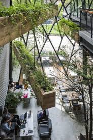 Steel Framed Cafe Becomes Hanging Garden In Vietnam Garden Cafe Cafe Interior Design Hanging Garden