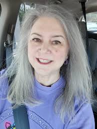 What hairstyle suggestions do you have for a 60-year-old woman with natural  gray hair?