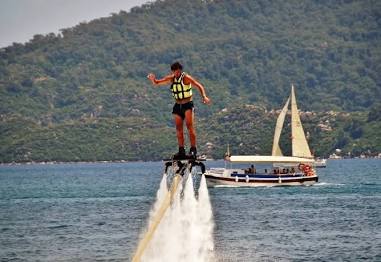 Flyboarding above the waters of the Chapora River, AI generated