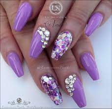 For an unusual twist on your nail art, you can use various shades of purple nail polish on your five nails. Stunning Mauve Acrylic Nails With Bling Mauve Nails Lilac Nails Purple Gel Nails