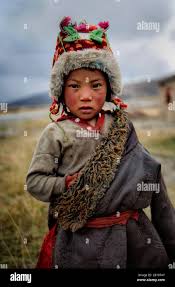 Tibetan child with traditional clothing ...