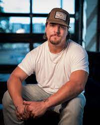 Gavin Adcock rips jeans, chugs whiskey and drops 'Own Worst Enemy'