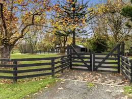 This decorative fence section consists of a 3 radius curve with stepped scalloped pickets dipping from 3 1 2 to 3. Peaceful Private And The Perfect Lifestyle Driveway Fence Farm Gate Entrance Farm Gate
