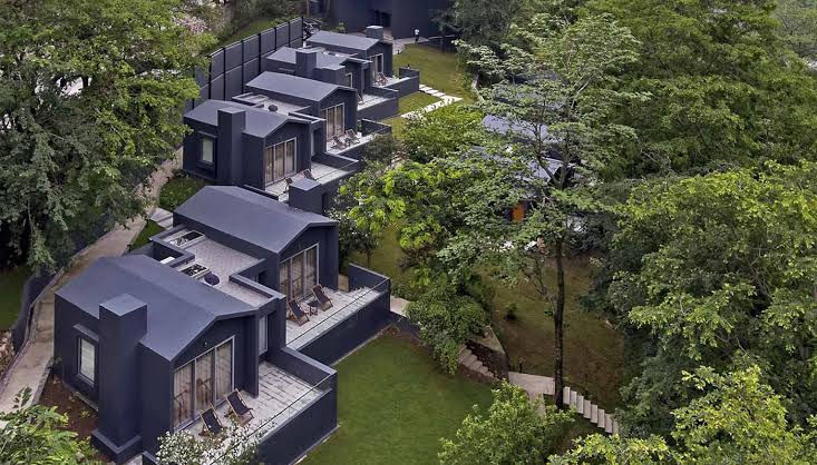 Forest-facing riverside setting representative of The Roseate Ganges style