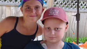 Kellogg Club swim team joins 'Team Hedda'