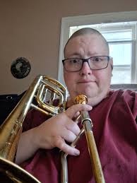 Bass trombonist getting adjustments made