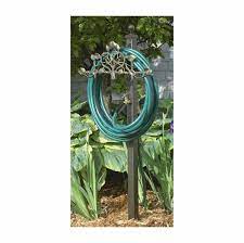 Wall mounted garden hose reel hanger holder storage hook rack pipe outdoor water. Post Mount Hose Holder Station With Decorative Vine And Faucet