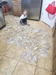 How To Remove Tile Flooring Yourself With Tips And Tricks Tile Removal Ceramic Floor Tile Cleaning Painted Walls