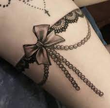 Leg garter tattoo pictures tattoo. 50 Lace Belt Garter Tattoos Designs 2021 Gun Bow On Thigh Leg