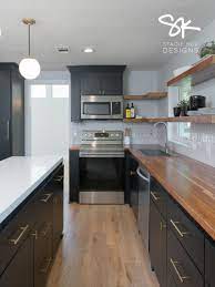 Mid Century Modern Kitchen In 2021 Wood Countertops Kitchen Kitchen Black Counter Modern Black Kitchen