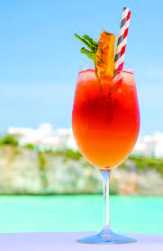 Rum punch in two glasses with cocktail umbrellas and straws. 16 Best Rum Cocktails Easy Rum Mixed Drink Recipes For Summer