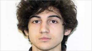 Boston Marathon bombing suspect charged in hospital bed
