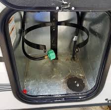 Handy lid opens for access to gas valves. Upgraded Propane Tank Support Bracket Truck Camper Magazine