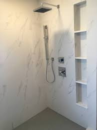 Tile is frequently used in shower stalls, as is cultured marble. Master Bathroom Porcelain White Marble Tile Gray Hexagon Shower Floor Contemporary Bathroom Austin By Custom Surface Solutions Houzz
