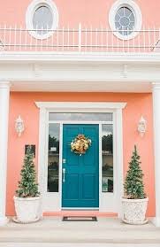 Lavender is an unexpected addition to an exterior color scheme, especially when paired with an equally colorful door. 79 Peach Houses Ideas Pink Houses House Exterior House Colors