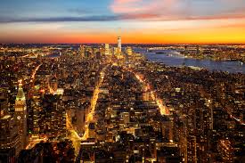 Top View Of New York City In Sunset Time With Building Of City A By Oscar Romero