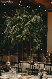 An Urban Wedding With Tall Greenery Tall Wedding Centerpieces Unique Wedding Flowers Urban Wedding