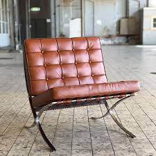 The barcelona chair achieves the serenity of line and the refinement of proportions and materials characteristic of mies van der rohe's highly disciplined architecture. Barcelona Chair Cognac Mies Van Der Rohe Furnpact