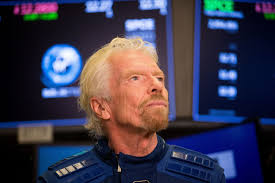 Branson blasts off: Mach 3 to zero G in a natty blue spacesuit