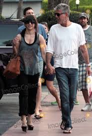 She was previously married to the late anthony bourdain. Photos And Pictures American Chef Author And Star Of The Travel Channel S Anthony Bourdain No Reservations Anthony Bourdain Gets Some Miami Ink During A Day Out In South Beach Bourdain And