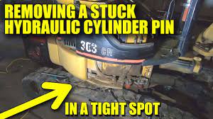Also, try vise grips on the pin head. How To Remove A Stuck Hydraulic Cylinder Pin Cat Mini Excavator Youtube