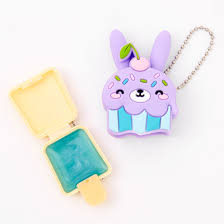 A sweet way to reward employees or thank your best customers! Pucker Pops Bunny Cupcake Lip Gloss Vanilla Frosting Claire S
