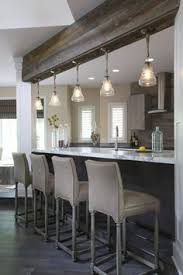 Large white kitchen with wood barstools and black pendants lights over the island with beautiful light oak floors #kitchen #allwhite. 7 Kitchen Breakfast Bar Stools Ideas Bar Stools Kitchen Stools Kitchen Bar Stools