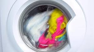 Soak the clothes in cold water containing salt or oxygen bleach, for few minutes. Washing Machine Washes Colored Clothing Stock Video Pond5