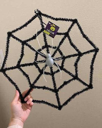 Dollar Tree DIY 🕸 Need a simple and cute Halloween decor idea that doesn't break the bank? I transformed this $1 spiderweb into a cute door hanger just by painting the spider