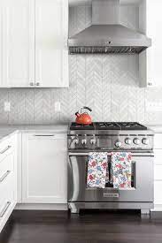Here, perfectly aligned gray tiles offer a subtle spin on the typically. White Modern Marble Chevron Backsplash Tile Backsplash Com